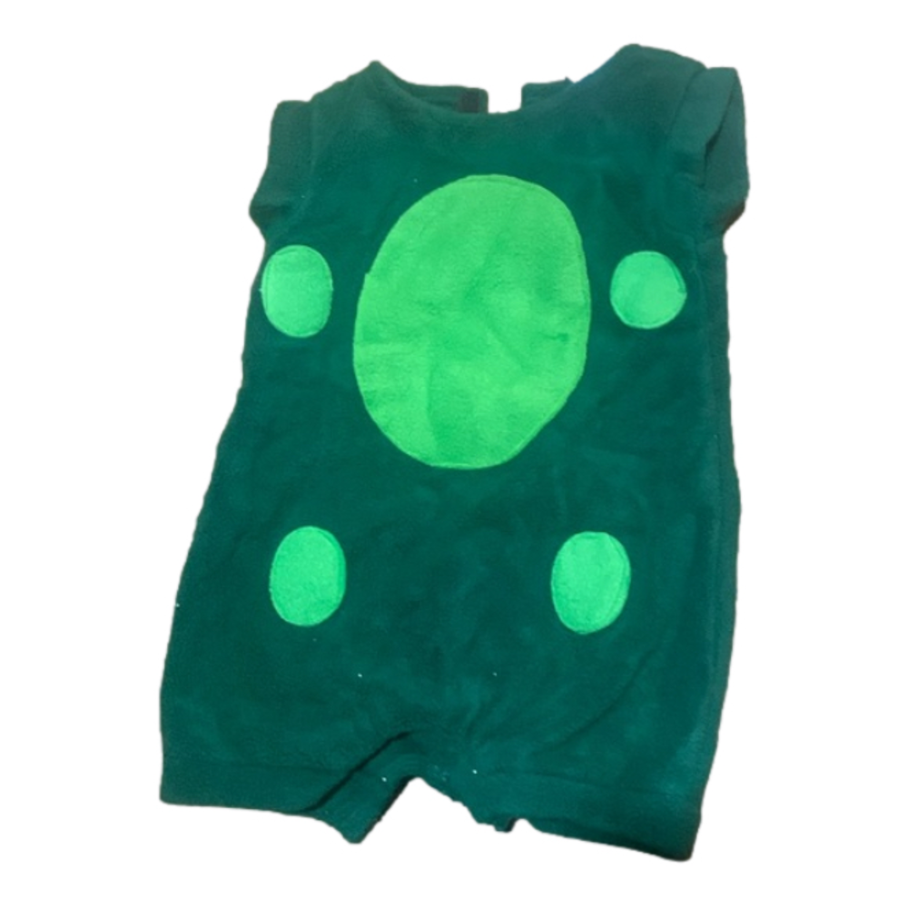 Infant green dinosaur soft outfit on rack
